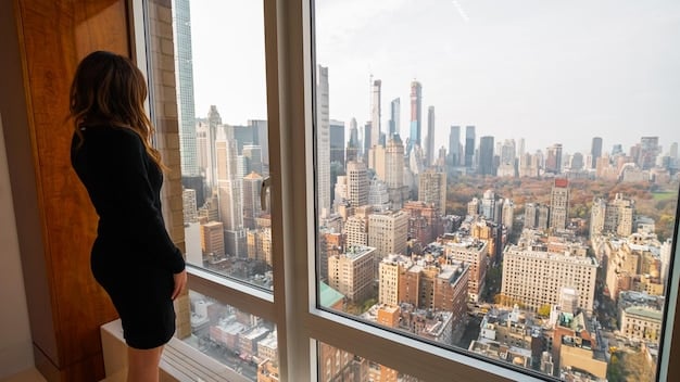 A modern penthouse apartment in New York City with floor-to-ceiling windows offering panoramic views of the Manhattan skyline. The interior is decorated with contemporary art and designer furniture, emphasizing luxury and sophistication in an urban setting.