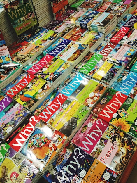 A photograph showcasing a detailed close-up of various comic book covers with different art styles and characters, emphasizing the diversity and artistic appeal of comic books.