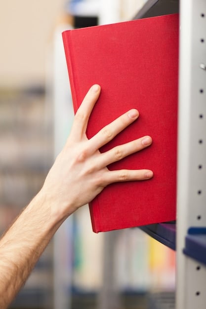 A close-up shot of a person carefully handling a comic book with gloves, showing the attention to detail needed for preservation.