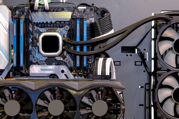 An open gaming PC case showing the motherboard, CPU cooler, GPU, and RAM modules, highlighting the importance of high-performance components for low-latency gaming.