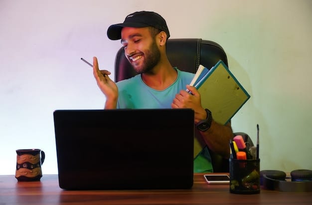 A student smiling while reviewing a scholarship application on a laptop, with a gaming headset and controller on the desk, illustrating the process of applying for gaming scholarships.