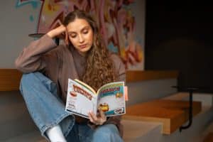 A girl who uses Compare the top Comic Book Grading Services of 2026.